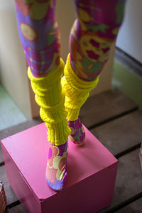 Low section of woman standing on tiled floor