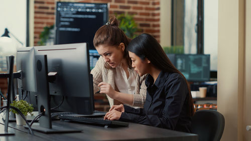 Businesswomen brainstorming in office