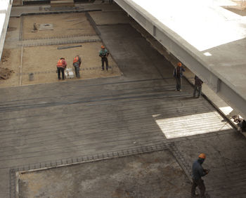 People walking on construction site