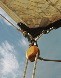 Low angle view of clothes hanging against sky