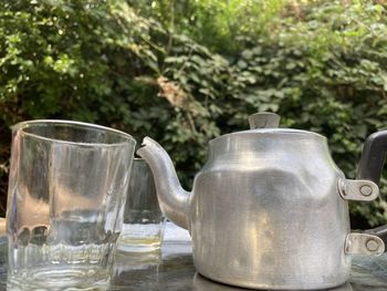 Close-up of drinking glasses on table