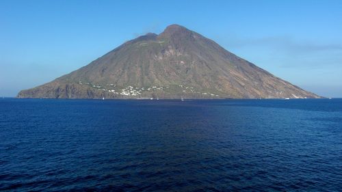Scenic view of sea against blue sky