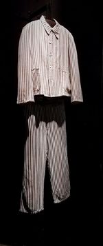 Close-up of clothes drying in darkroom