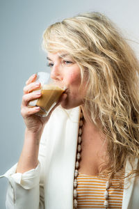 Close-up of a woman drinking glass