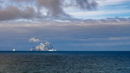 Scenic view of elephant island, antarctica in the sea against the sky.