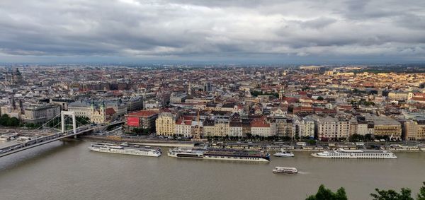 High angle view of river amidst buildings in city