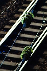 High angle view of ropes tied on metal