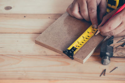 Midsection of person working on table