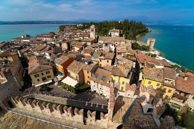 High angle view of townscape by sea