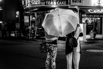 Rear view of man standing on street