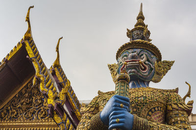 Giant statue is protect the darknest in the grand palace bangkok, thailand.