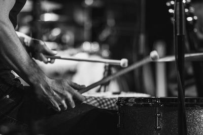 Close-up of drummer at music concert