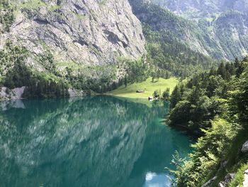 Scenic view of lake and mountains against sky