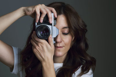 Person taking a photo in the studio