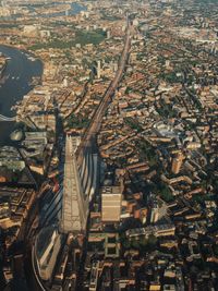 Aerial view of shard london bridge amidst buildings in city on sunny day