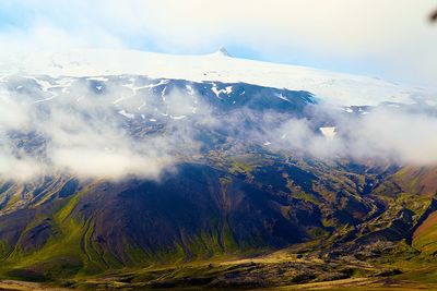 Scenic view of snowcapped mountains against sky