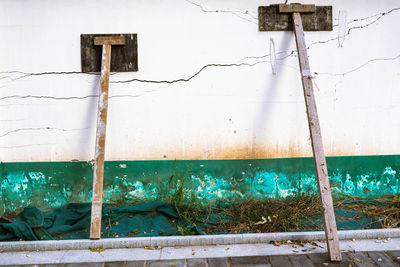 Abandoned building against wall