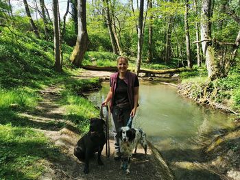 Woman with dog in the forest