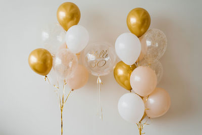 Festive helium balloons in gold and white for the 30th anniversary