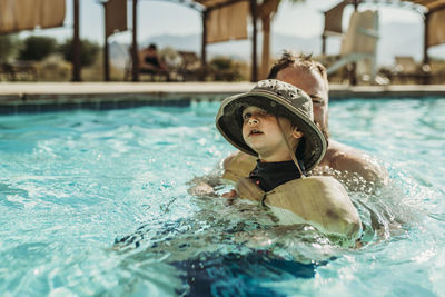 Portrait of man swimming in pool