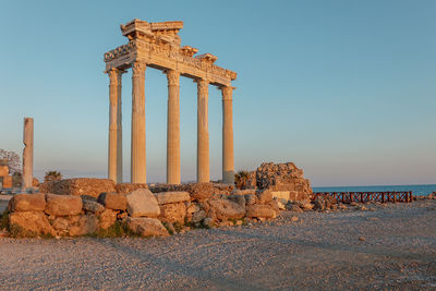 Panoramic view of ruins of ancient temple of apollo in side on sunset, alanya province, 