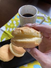 Cropped hand of person preparing food