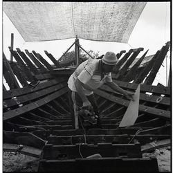 Man working at construction site against sky