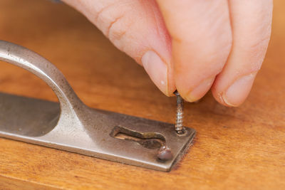 Close-up of hand holding ring