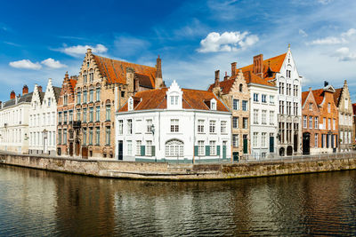 Famous view of bruges canal and old historic houses of medieval architecture. brugge, belgium