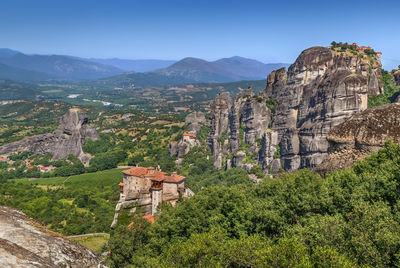 Panoramic view of trees and mountains against sky