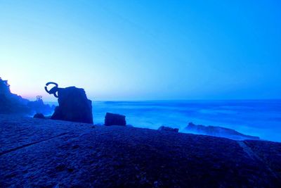 Scenic view of sea against blue sky