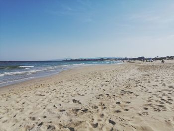 Scenic view of beach against clear sky