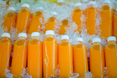 Close-up of orange juice on table