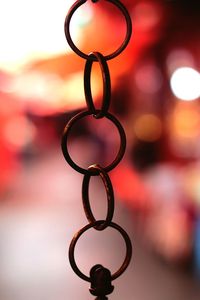 Close-up of heart shape hanging on metal