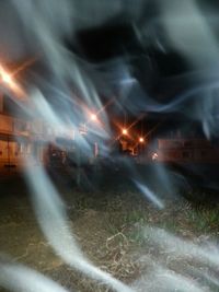 Blurred motion of illuminated ferris wheel