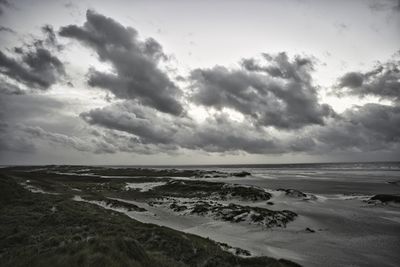 Scenic view of beach against sky