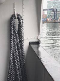 Close-up of rope hanging on pier