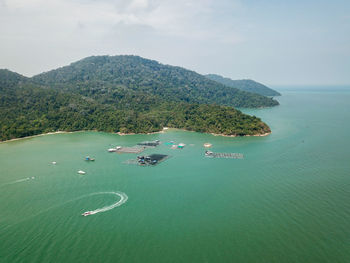 High angle view of boats in sea against sky