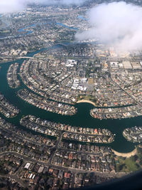 High angle view of illuminated city buildings by river