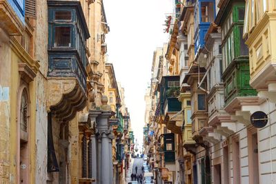 Street amidst residential buildings in city