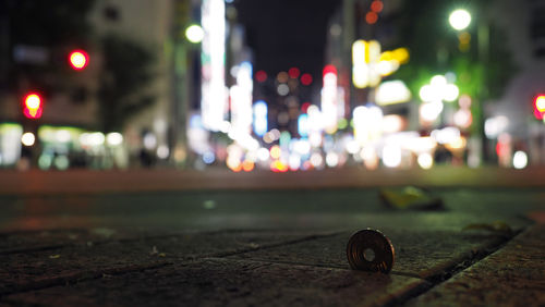 Close-up of illuminated city street at night