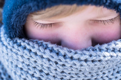 Close-up of cute boy in snow