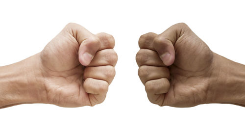 Close-up of hand against white background