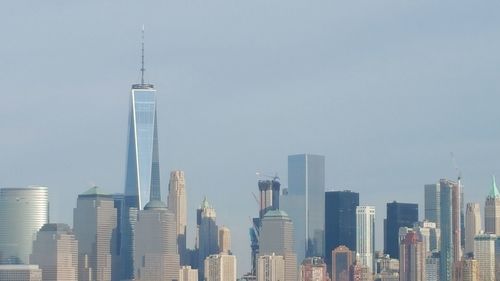 Modern buildings in city against sky