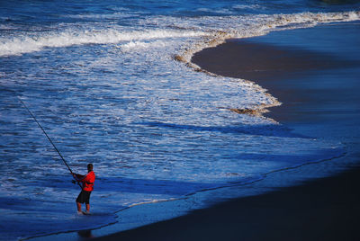 Man fishing in sea