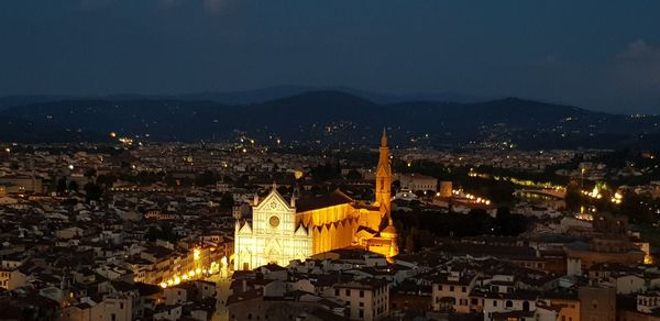 High angle view of illuminated buildings in city at night