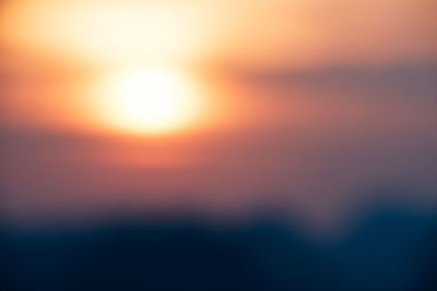 Defocused image of dramatic sky during sunset