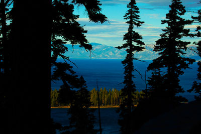 Scenic view of lake against sky at sunset