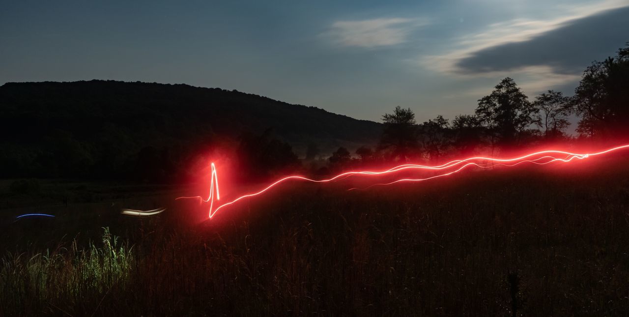 sky, illuminated, beauty in nature, cloud - sky, scenics - nature, nature, no people, red, night, long exposure, non-urban scene, plant, land, glowing, field, landscape, tranquil scene, environment, outdoors, tranquility, power in nature