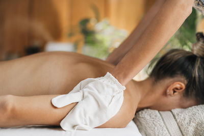 Ayurveda garshana massage, dry massaging technique with raw silk garshana gloves